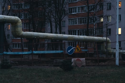 Water supply repair works in the city. Construction site in the evening photo
