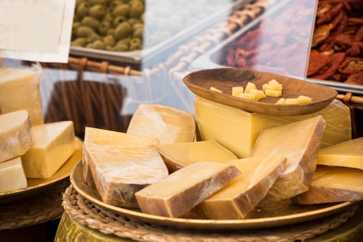 Chunks of different cheeses at a local european market photo