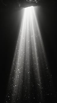 Light rays penetrate darkness creating a serene atmosphere underwater photo