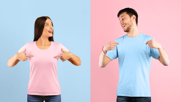 Portrait of egocentric couple pointing at themselves and looking at each other isolated on blue and yellow studio wall photo