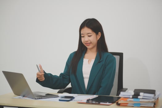 Business, finance and employment, female successful entrepreneurs concept. Friendly smiling office manager greeting new coworker. Businesswoman welcome clients with hand wave, hold laptop photo