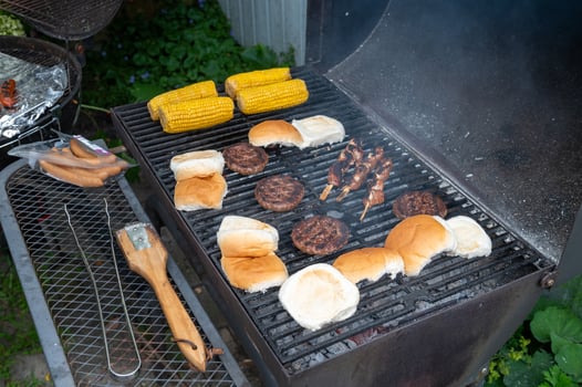 Summertime Backyard Barbecue with Burgers and Corn on the Grill photo