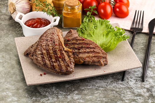 Delicus grilled beef steak with sauce photo