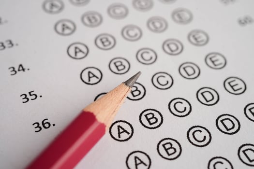 Answer sheets with pencil drawing fill to select choice, education concept. photo