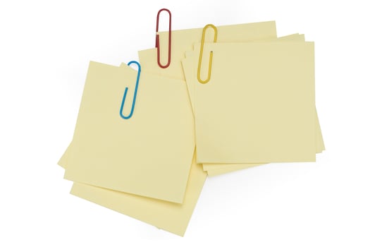 Office table with pen, note papers and paper clips top view photo