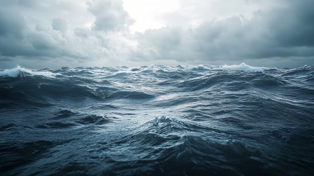 A large body of water with a stormy sky above photo