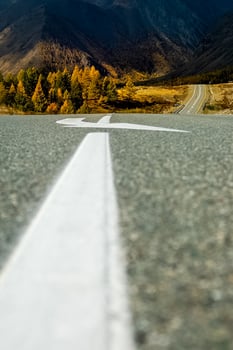 Asphalt road to the mountains. Mountain track on Altai. photo