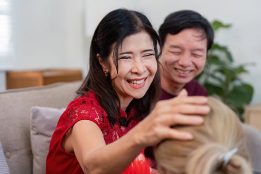 Celebrating chinese new year with family grandparents and granddaughter cherishing moments home lifestyle joyful gathering photo