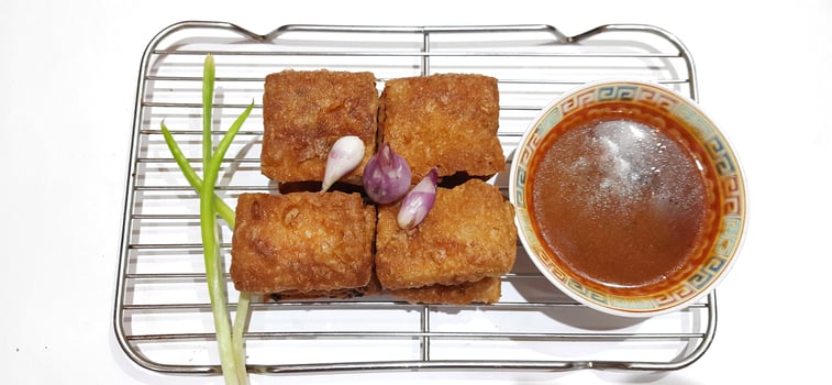 Martabak telur or Martabak telor. Savory pan fried pastry stuffed with egg, meat and spices served with sauce, Indonesian street food photo