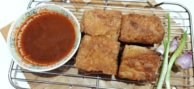Martabak telur or Martabak telor. Savory pan fried pastry stuffed with egg, meat and spices served with sauce, Indonesian street food photo