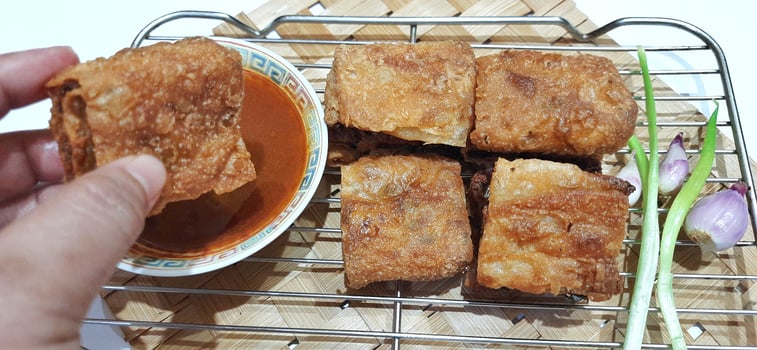 Martabak telur or Martabak telor. Savory pan fried pastry stuffed with egg, meat and spices served with sauce, Indonesian street food photo
