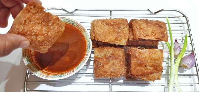 Martabak telur or Martabak telor. Savory pan fried pastry stuffed with egg, meat and spices served with sauce, Indonesian street food photo