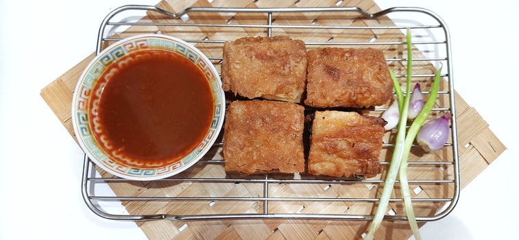 Martabak telur or Martabak telor. Savory pan fried pastry stuffed with egg, meat and spices served with sauce, Indonesian street food photo