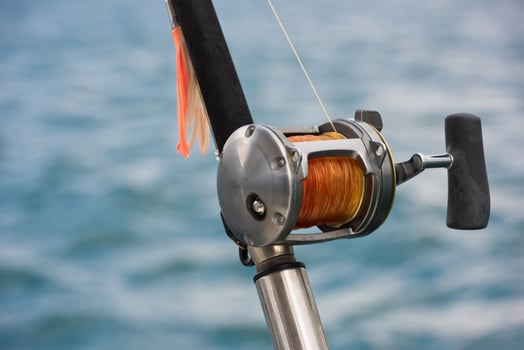 Fishing rod and reel on a boat photo
