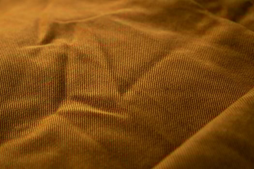Close up bright brown jeans fabric background texture. photo