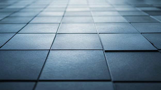 A blue tile floor with a white border photo