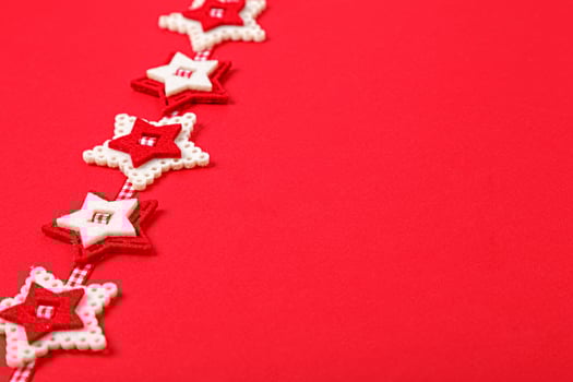 Christmas garland on a red background photo