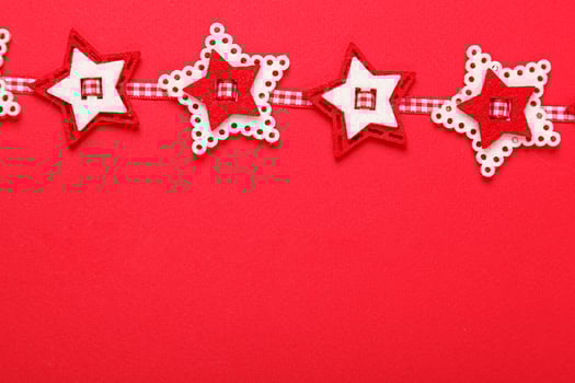 Christmas garland on a red background photo