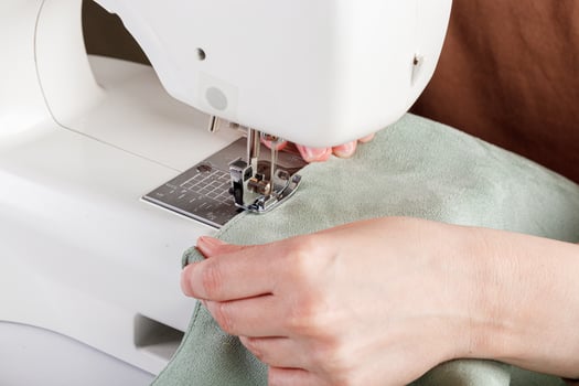 Sewing machine, stitching fabrics, needle in a round plan photo