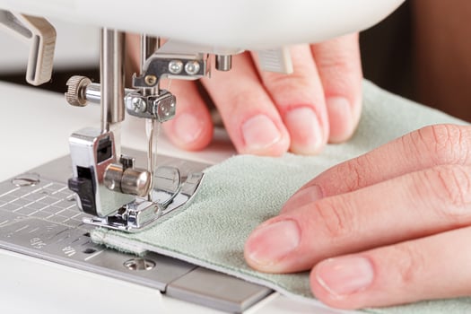 Sewing machine, stitching fabrics, needle in a round plan photo
