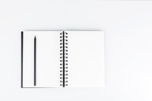 business notepad with pencil on white background photo