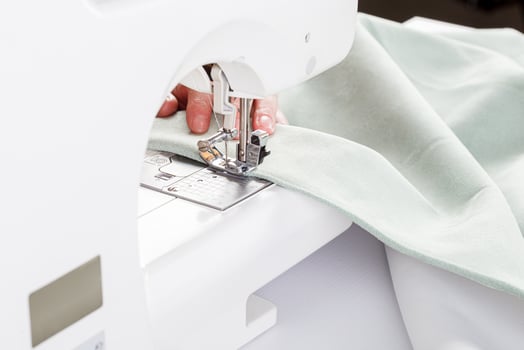 Sewing machine, stitching fabrics, needle in a round plan photo