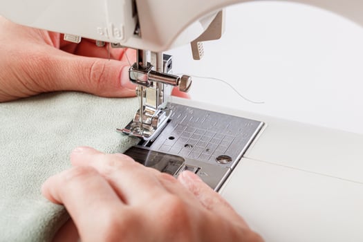 Sewing machine, stitching fabrics, needle in a round plan photo