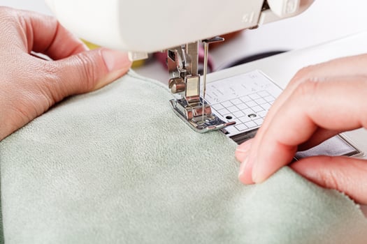 Sewing machine, stitching fabrics, needle in a round plan photo