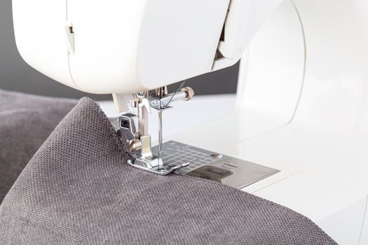 Sewing machine, stitching fabrics, needle in a round plan photo