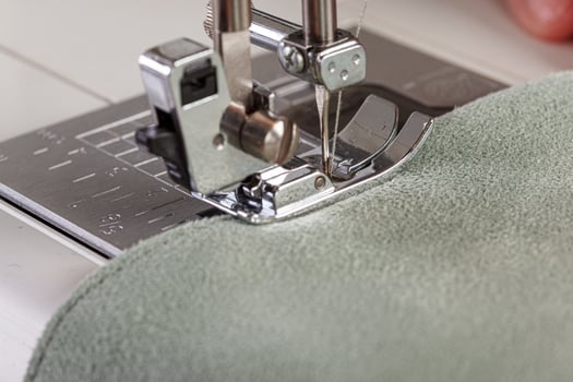 Sewing machine, stitching fabrics, needle in a round plan photo