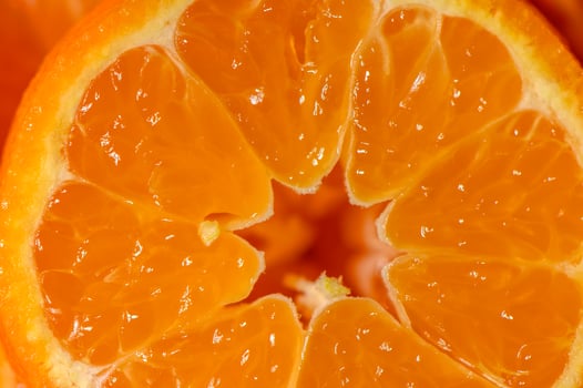 Juicy orange slices reveal refreshing texture and vibrant color in a close-up view photo