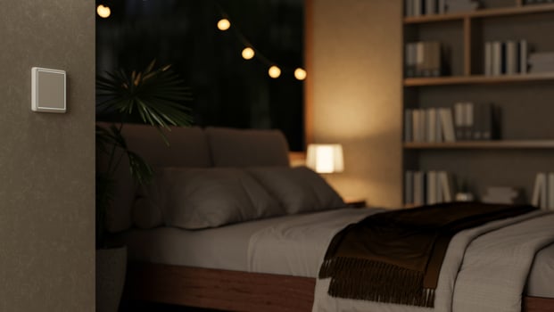 A cozy, contemporary bedroom at night featuring a comfortable bed and sleek home decor. photo
