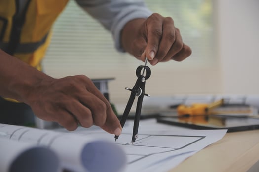 Image of engineer meeting for architectural project. working with partner and engineering tools on workplace vintage tone. photo