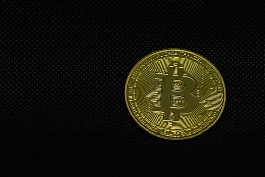 Top view of bitcoin on dark background photo