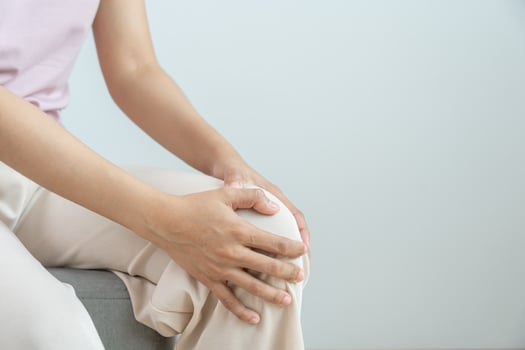 female athlete or spot woman having knee injury due to ligament inflammation, knee pain due to exercise, massage, muscle relaxation, rheumatoid arthritis, gait disturbance, rheumatoid arthriti photo