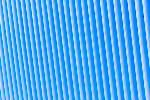 Detail of blue striped metal facade for background photo