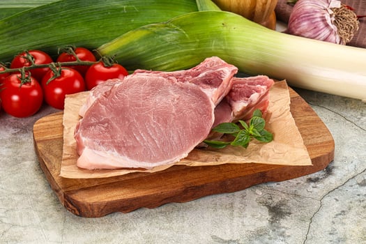 Raw pork steak loin with bone photo