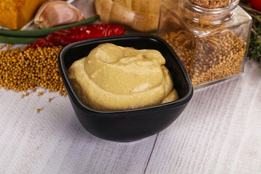 Dijon mustard sauce in the bowl photo