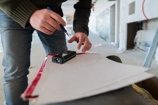 A close-up of an engineer's hand meticulously sketching an architectural project, capturing the precision, creativity, and focus involved in bringing innovative designs to life photo