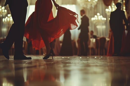 A couple in formal attire dancing at a ball photo