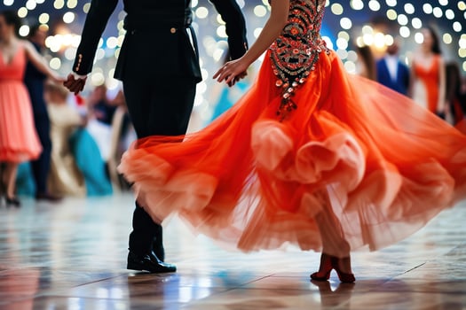 A couple in formal attire dancing at a ball photo