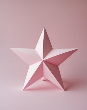 a close up of a pink star on a pink background photo