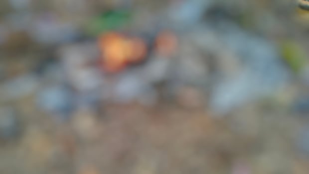 A close up of a fire pit with a small fire photo