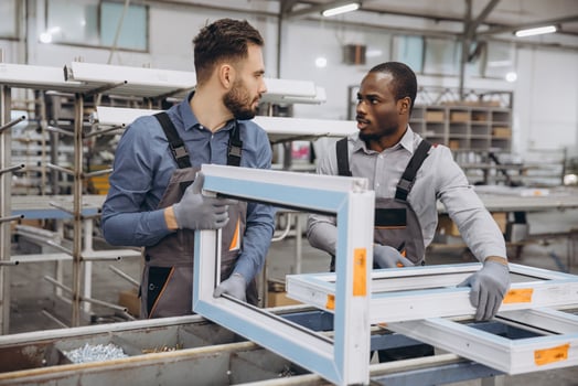 Factory Workers Manufacturing PVC Windows in Production Line photo