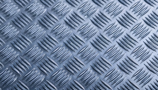 close-up of galvanized steel surface with blue-tinted diamond plate pattern and reflective finish photo