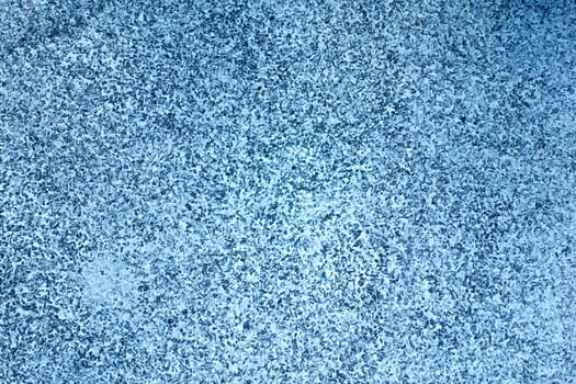 textured blue surface with speckled pattern, creating calming and serene atmosphere. This evokes feelings of tranquility and coolness, perfect for various design projects photo