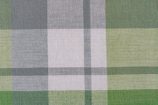 Green and white checkered fabric as a background. photo
