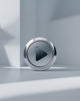 metallic play button showing beginning on gray background photo