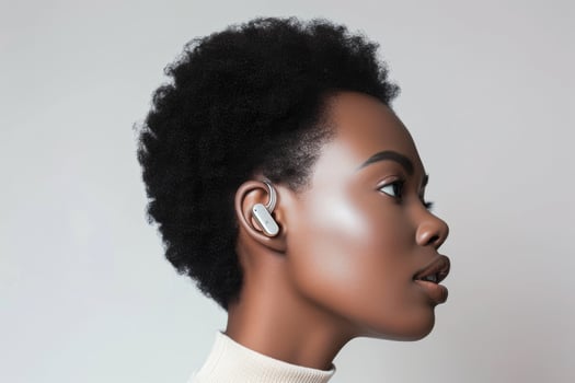 A woman with a white earbud in her ear photo