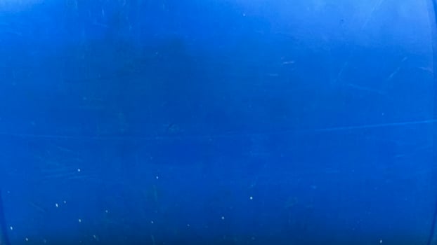 Deep ocean view with vibrant blue tones and floating particles photo